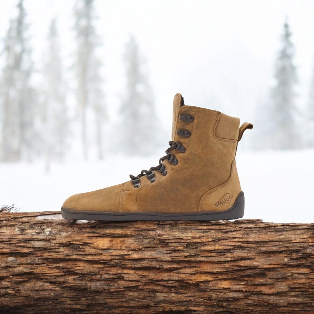 Handcrafted RealFoot Farmer Winter Boots with wide toe box and insulation, offering natural comfort and warmth for winter.